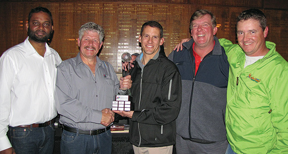 Golf challenge winners Afrilek receive the trophy (left to right) Pregs Naidoo, Johan Maritz (branch chairman), Jurie Weidemann, Jacques Siebretts and Riaan Burger.